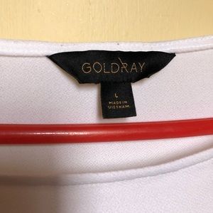 White, short sleeve top with cute diamond cutouts on sleeve